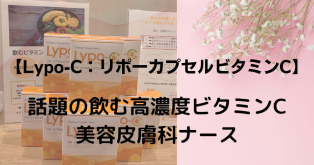 Orange boxes are piled up, a leaflet in the back and a bouquet in the upper right